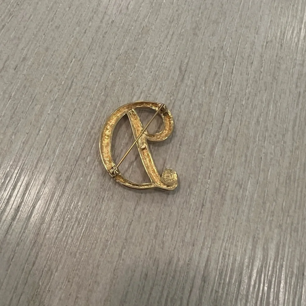 Vintage Monet D letter rhinestone brooch